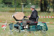 Robot mower carrying its English constructor.
He complained later, that the attention was attracted by small robots, and almost nobody visited him.